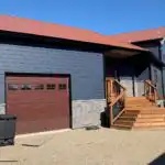 Winnipeg lap siding metal roof stone accent exterior modern renovations