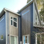 Winnipeg lap siding vertical cladding mixed exterior renovation modern renovations
