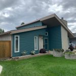 Modern home renovation winnipeg general contractor teal siding stone accents exterior renovations 128f39ea fbc0 44b2 816d a8040c08da4e