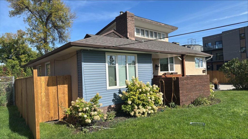 Modern renovations winnipeg contractor home renovation exterior blue vinyl siding 5377830c 9549 42c8 bc92 2f688ef89f09