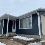Winnipeg home renovation contractor dark blue siding white trim snowy landscape 67fccaa7 22a3 4641 b284 e34bfcf033e0