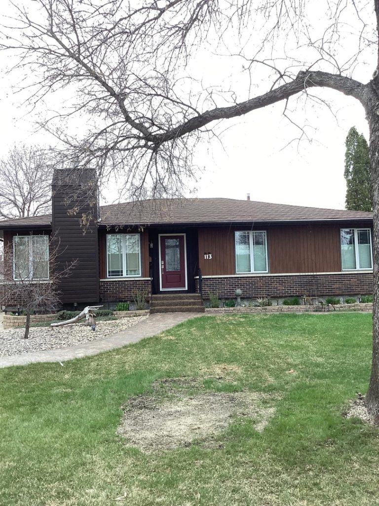Winnipeg home renovation contractor dark brown siding brick accents exterior renovations 815161fe d6ac 4556 a140 8969840b6e80