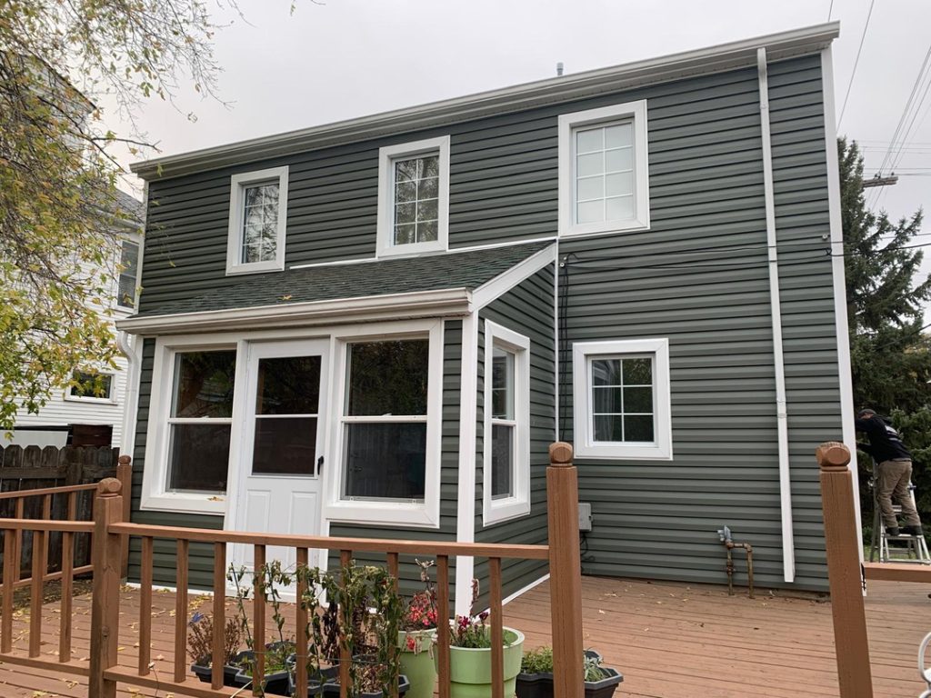 Winnipeg home renovation contractor dark green vinyl siding deck 431c0386 09eb 4a85 a8e1 c9d5358ebd3b