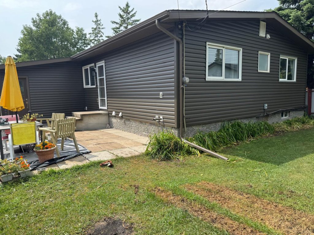 Winnipeg home renovation contractor exterior remodeling brown vinyl siding 832d4b4f 78f7 4846 810b 466662a5472b