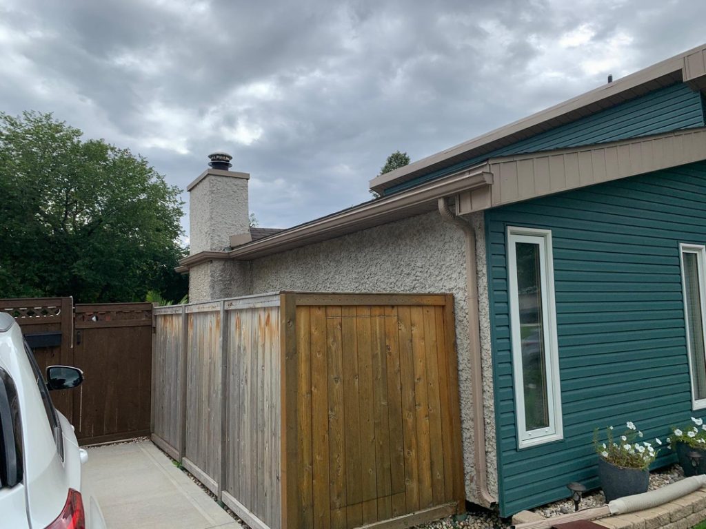 Winnipeg house exterior renovations blue siding white trim contractor 6243f7c5 3eb0 471e b42a e6560fb3a5f7