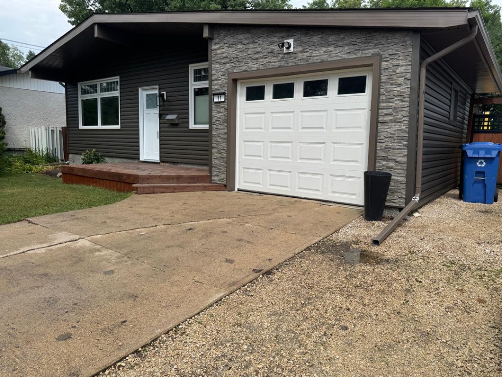 Winnipeg modern renovations contractor dark brown siding stone accents 32f714b2 bf76 4a83 8574 10e087100f59