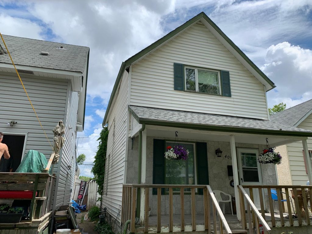 Winnipeg white siding gabled roof home renovation exterior renovations 928f0a24 50d6 4e20 92a6 233a83dde25e